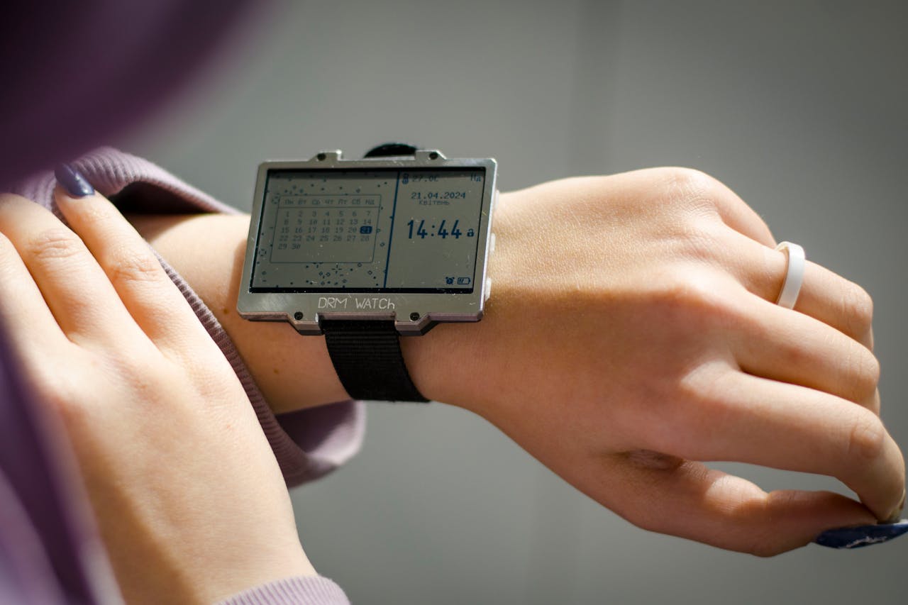 Close-up of a DIY digital watch on a wrist showcasing time and date. Unique modern design for tech enthusiasts.